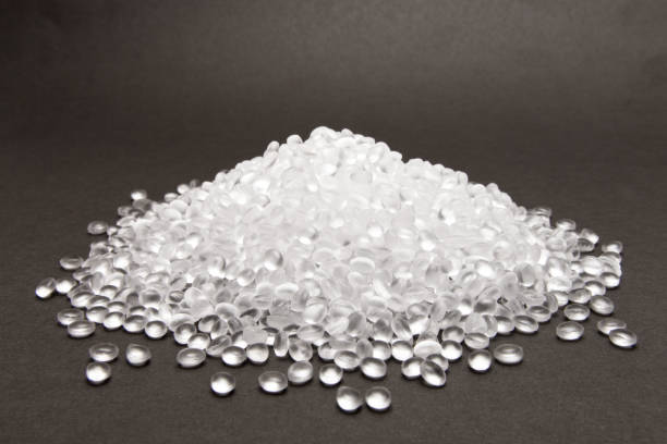 Transparent Polyethylene granules on dark .HDPE Plastic pellets.  Plastic Raw material . IDPE.